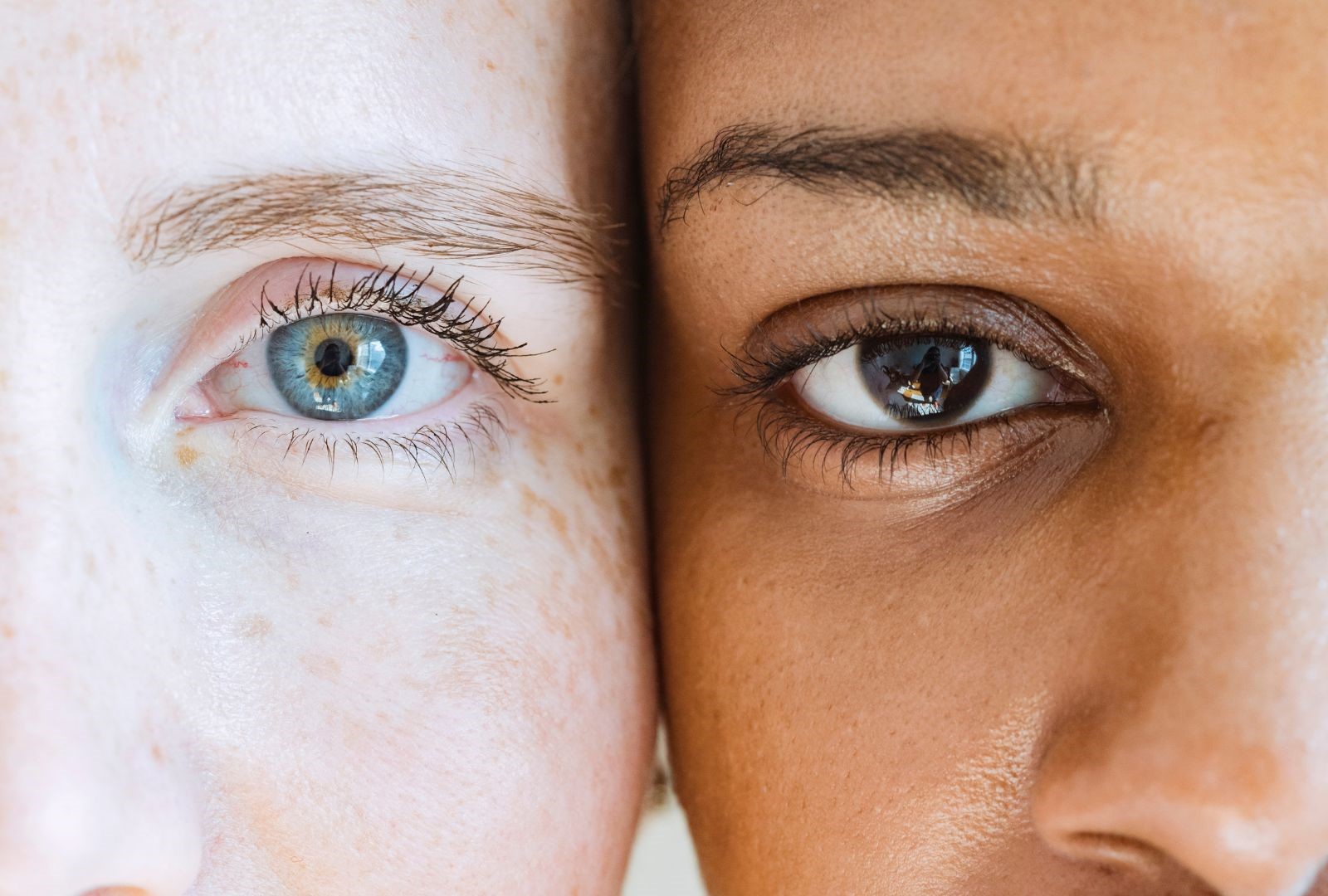 Closeup of two diverse women looking at a camera