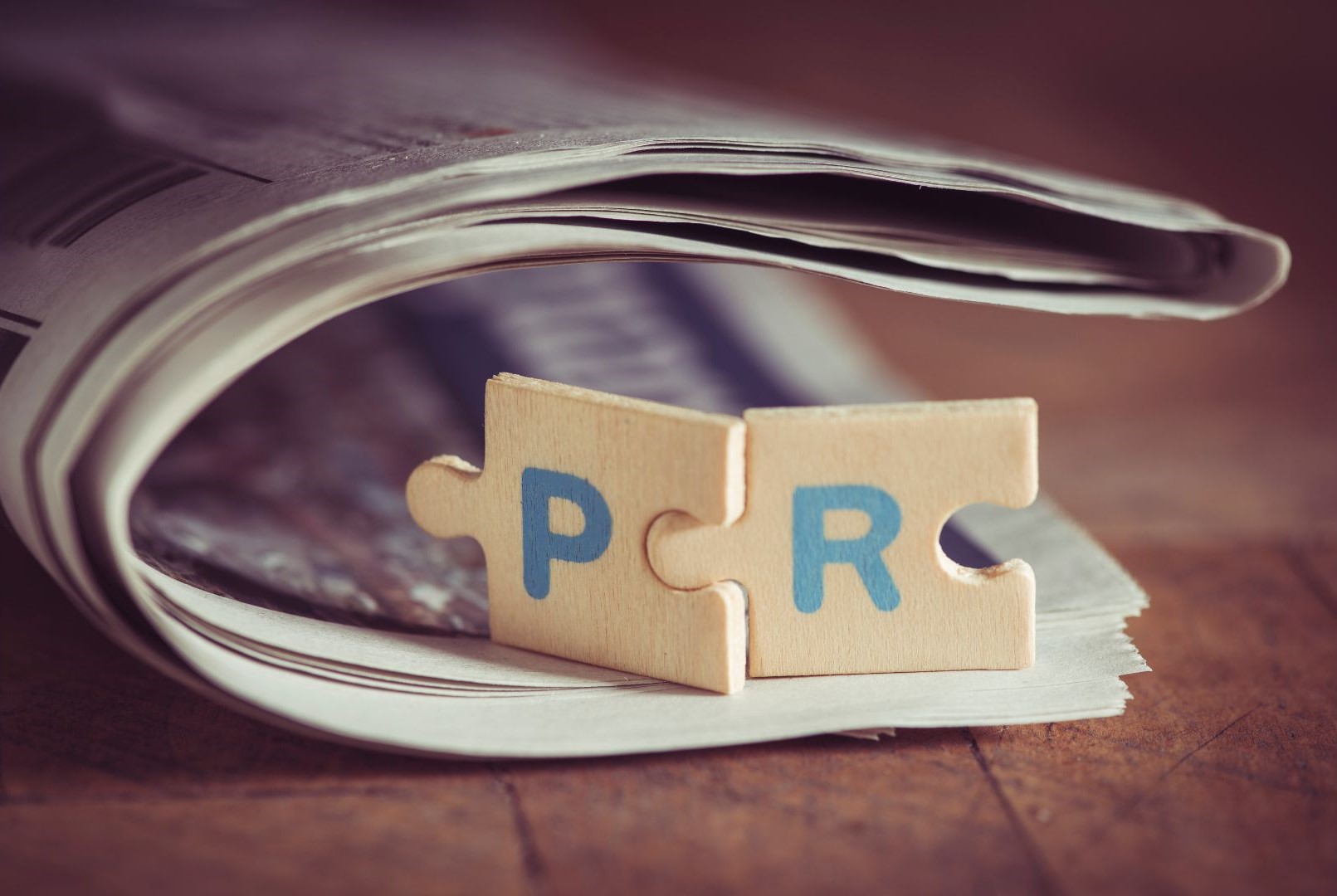 Close up PR letters on newspaper